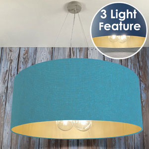 Turquoise Light shade with gold lining and 3 lights.